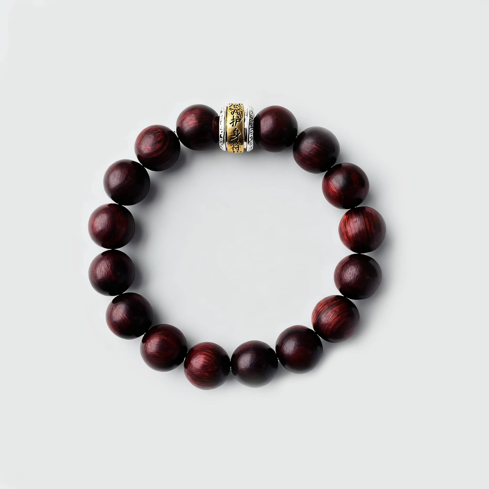 Antique rosewood mala bracelet featuring smooth beads and a decorative gold separator