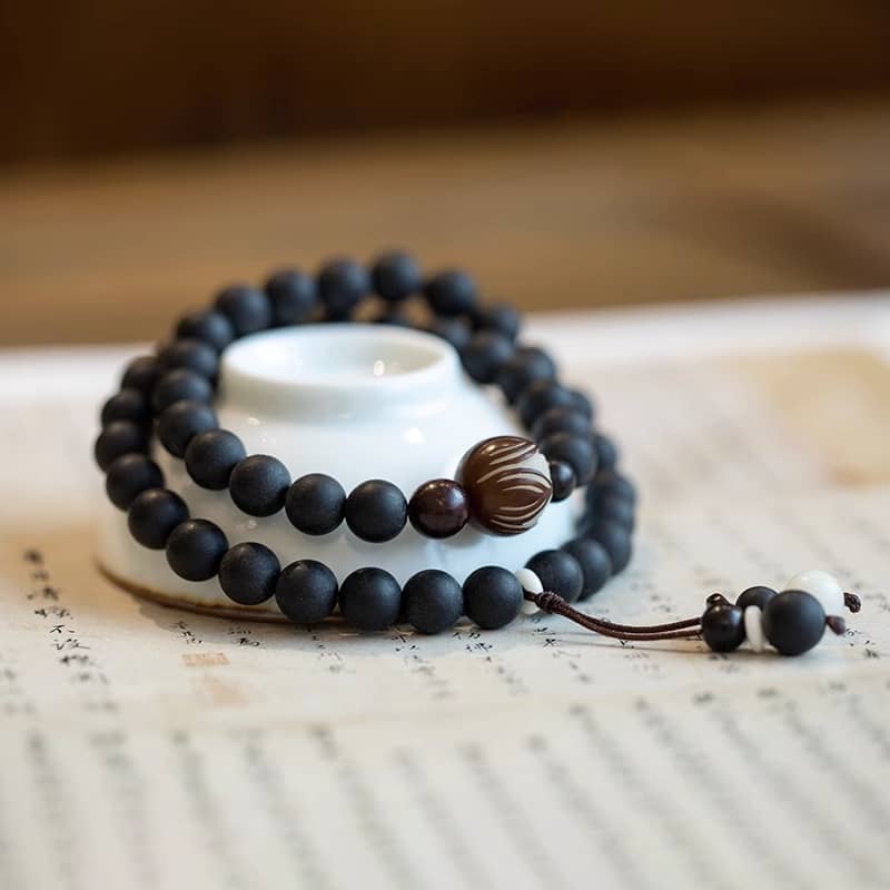 Stylish black amber double wrap bracelet made of matte beads for calm and relaxation