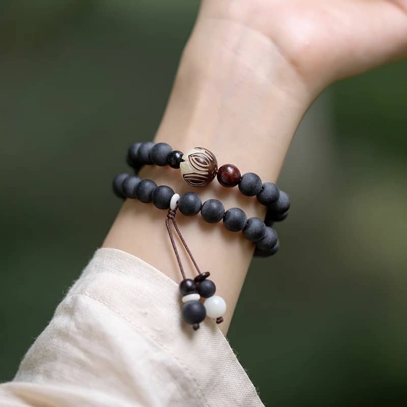 Black amber double wrap bracelet crafted with wooden beads for a natural look