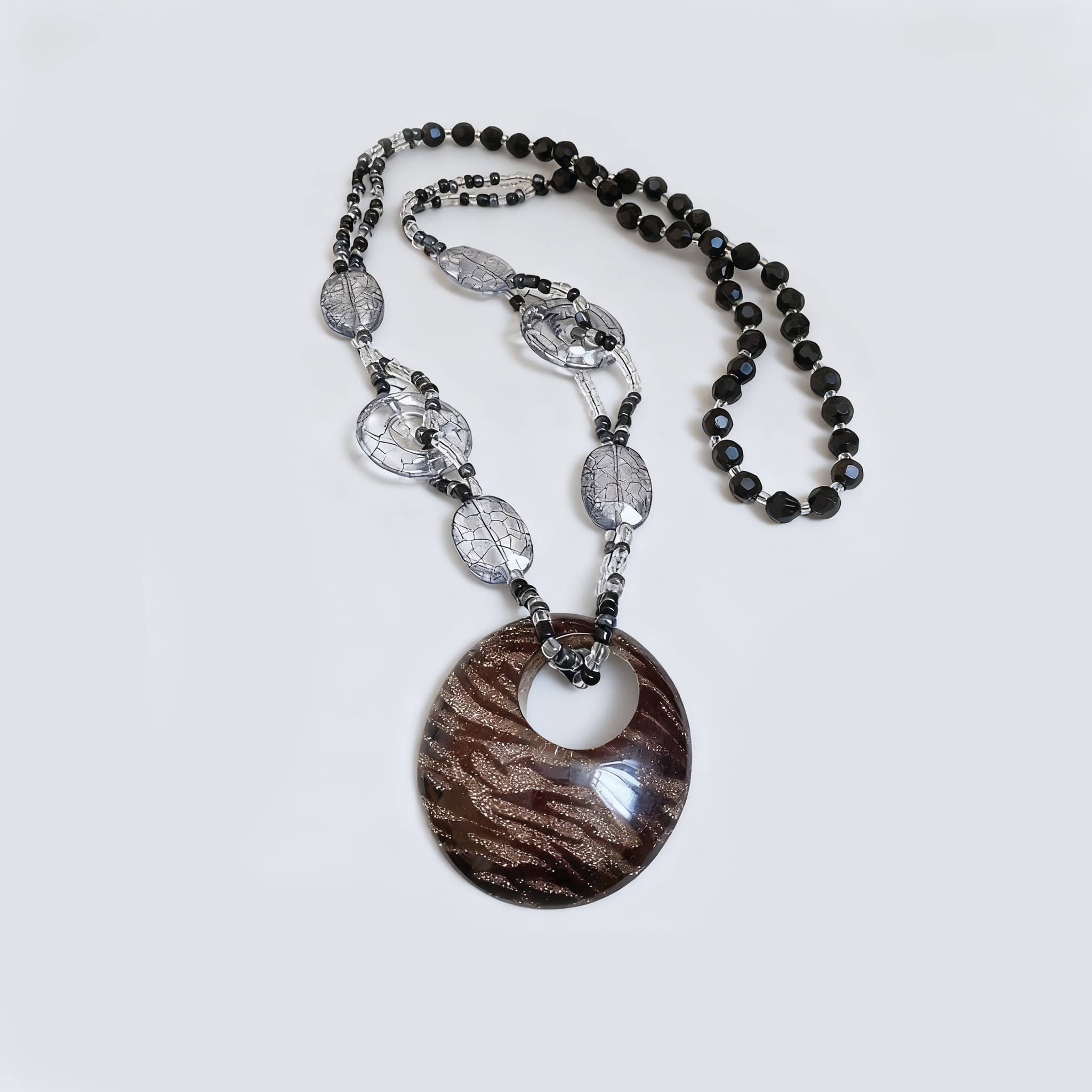 Black leopard pendant necklace with intricate patterns and beaded accents for a stylish look