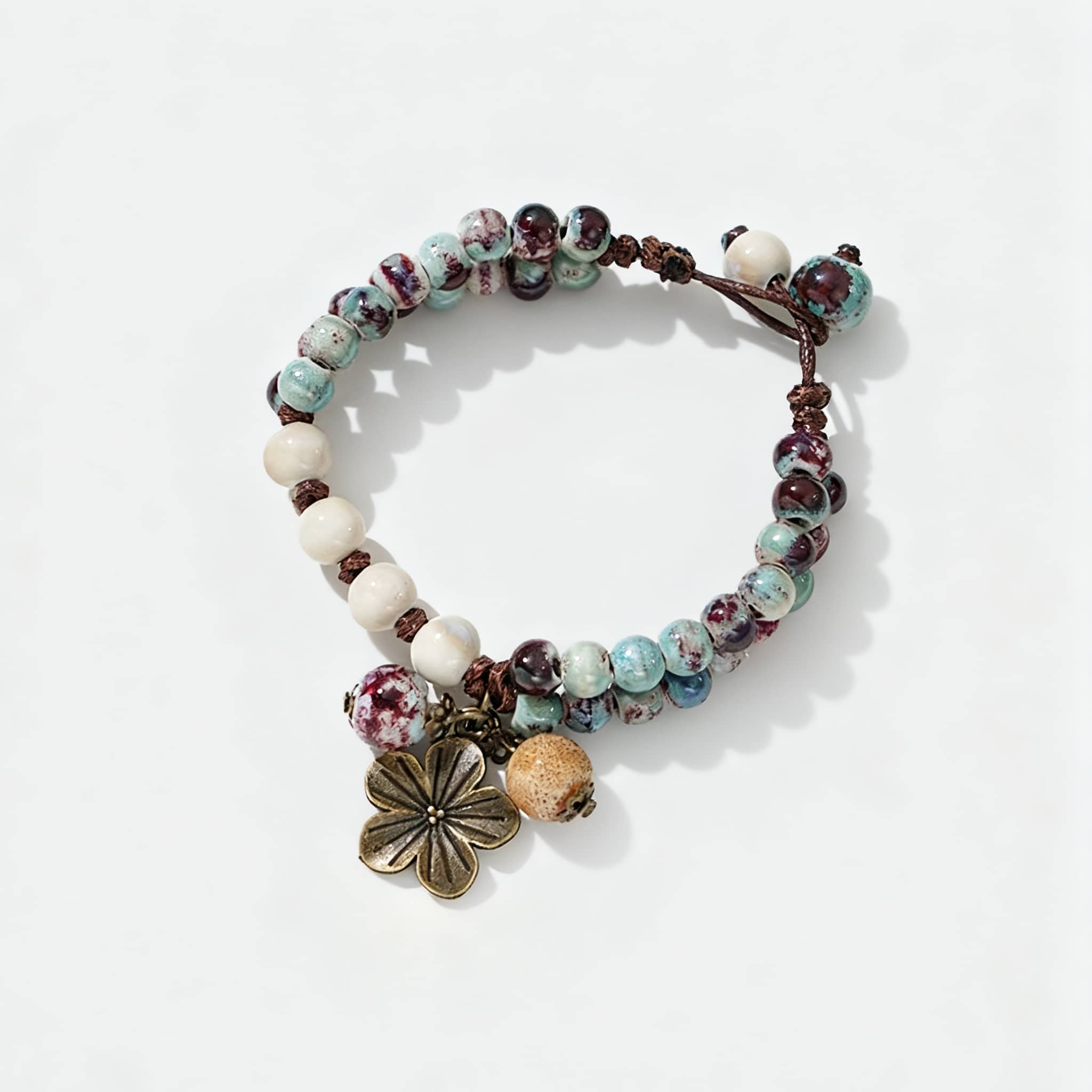 5 Senses ceramic floral charm bracelet featuring colorful beads and a decorative flower charm