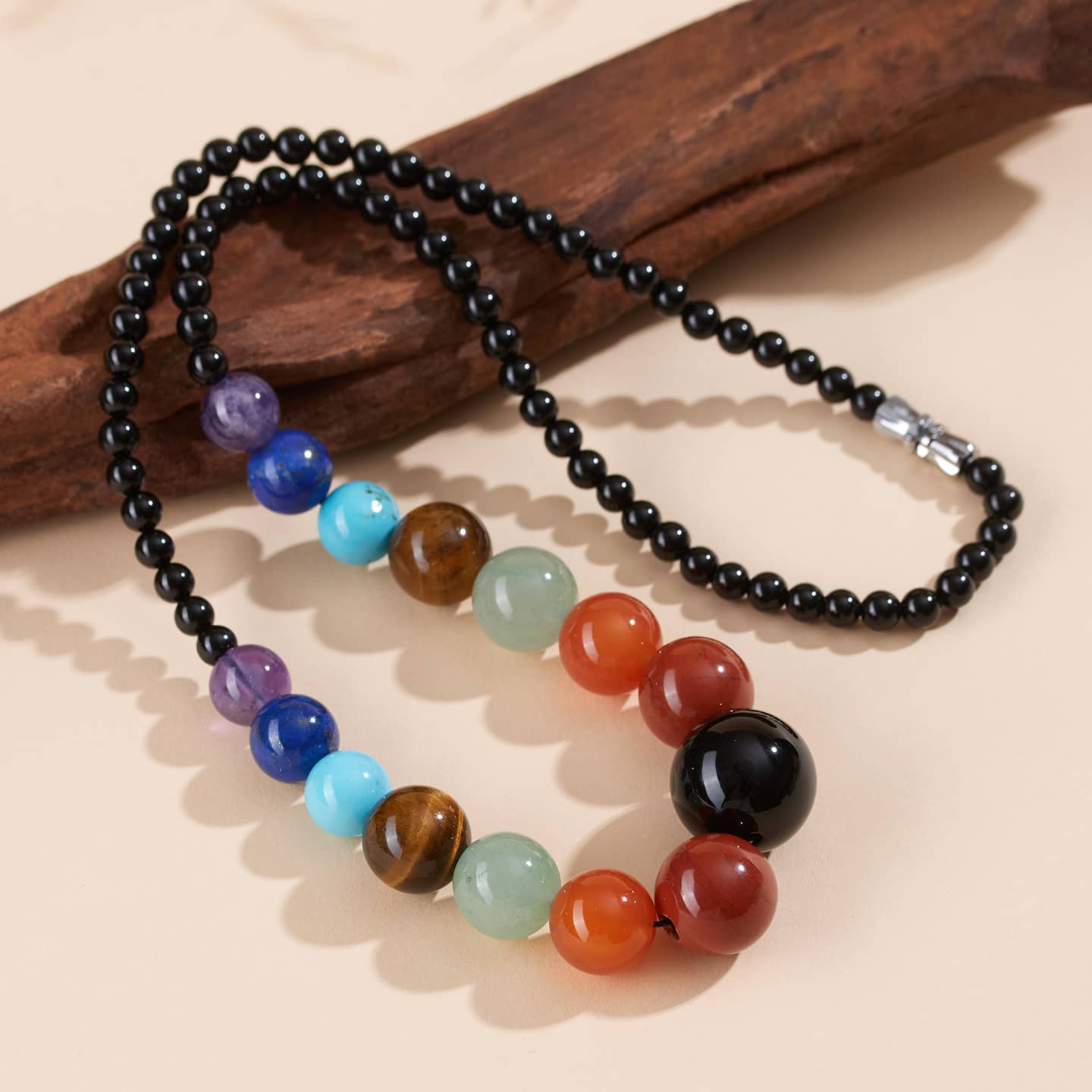 5 Senses crystal necklace for stress and self care featuring colorful gemstone beads and a sleek design
