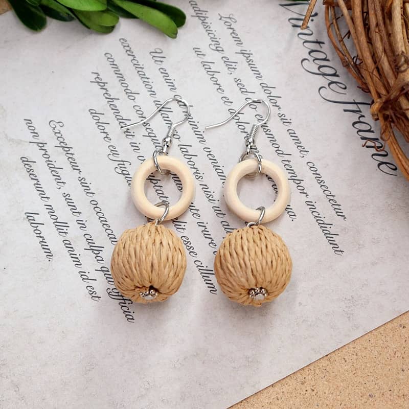 Bamboo woven earrings featuring natural fibers and wooden accents for a stylish look