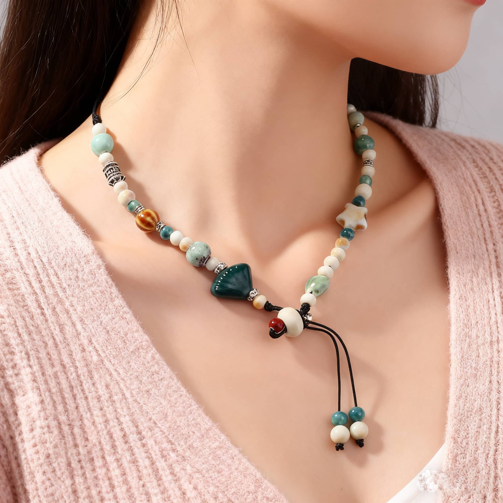Handcrafted ceramic scallop necklace with colorful beads and adjustable cord for a unique style