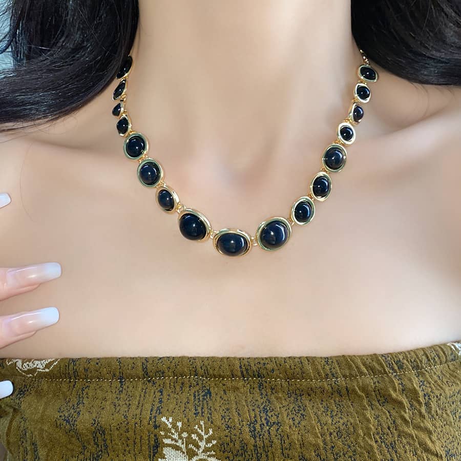Elegant geometric resin pendant necklace with gold accents for a stylish look