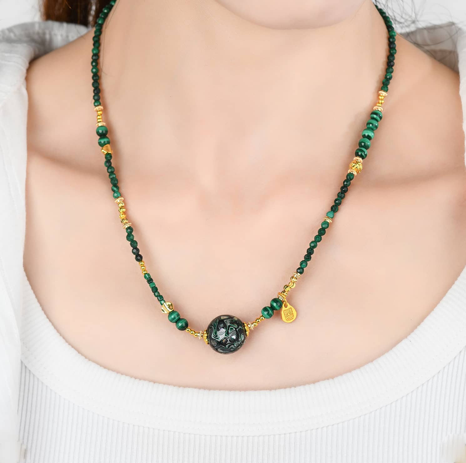 Green urushi mindfulness necklace with unique beads and gold accents for a stylish look