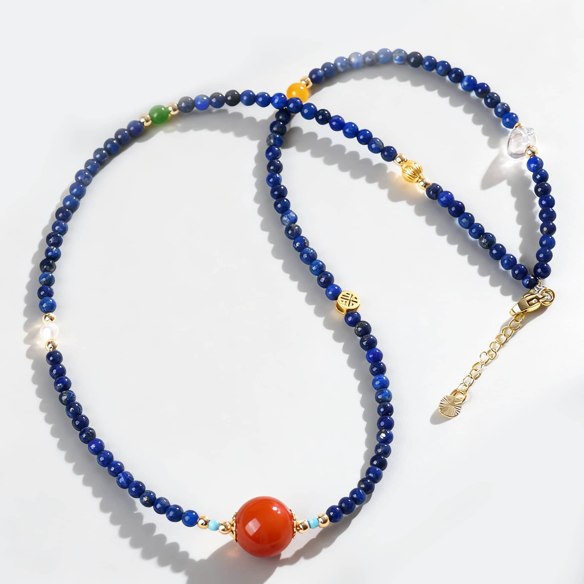 Lapis lazuli and red agate jewelry necklace with vibrant beads and gold accents for stylish wear
