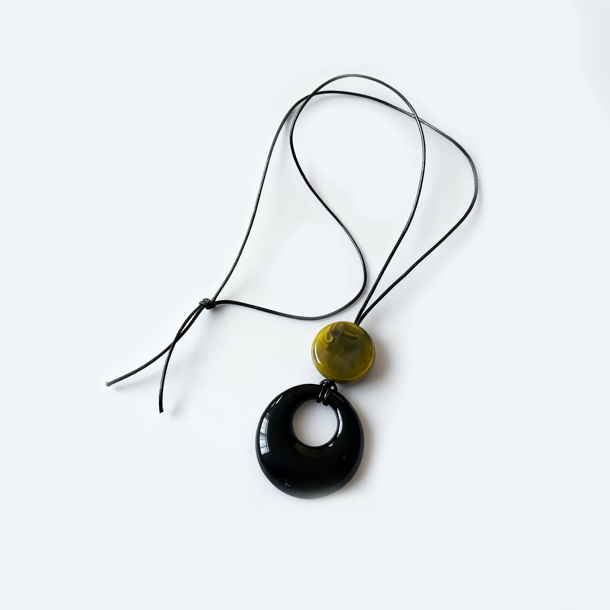 Unique Angry resin pendant necklace for mindfulness with a black and green design and adjustable cord