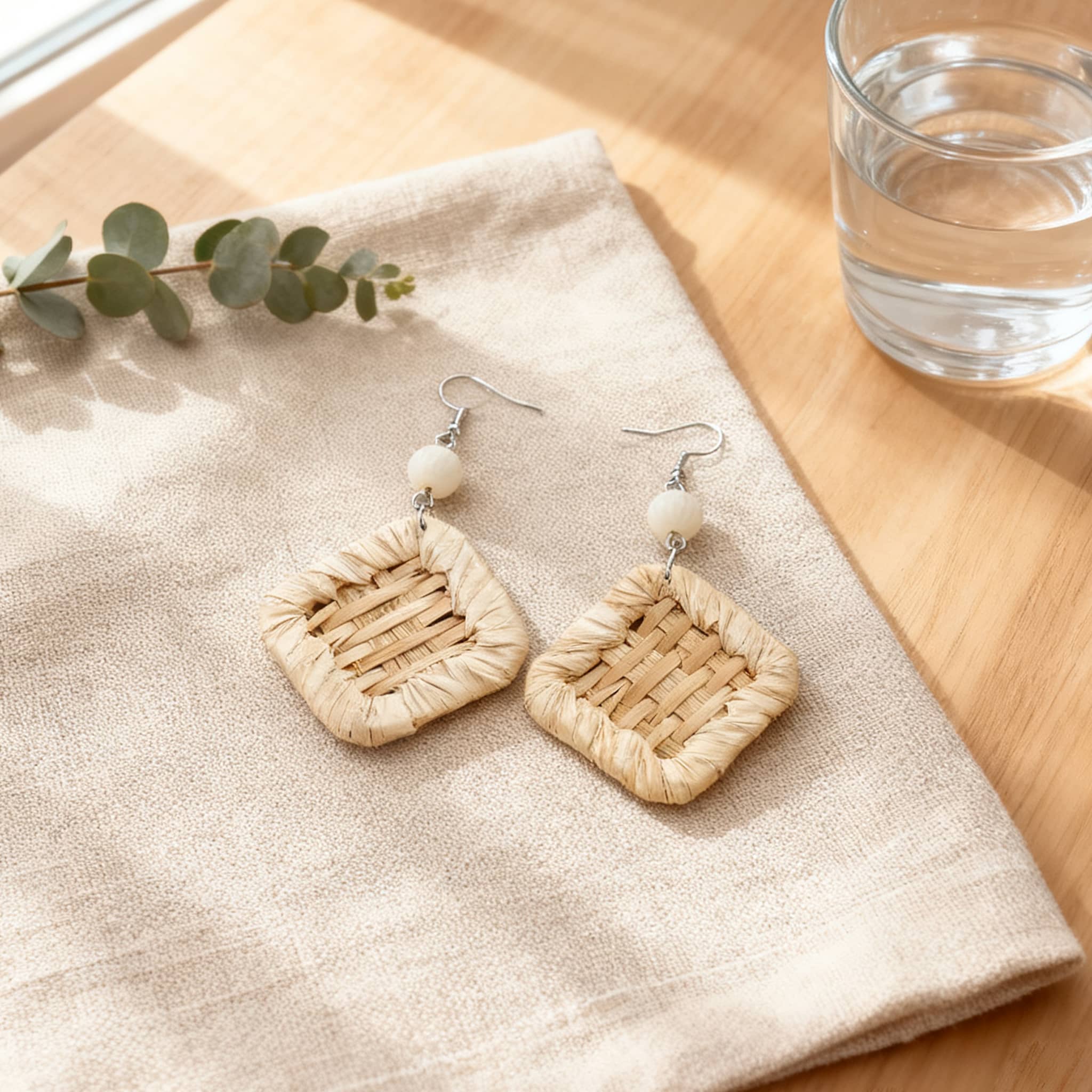 Square rattan earrings for women with a natural woven design and a white bead accent