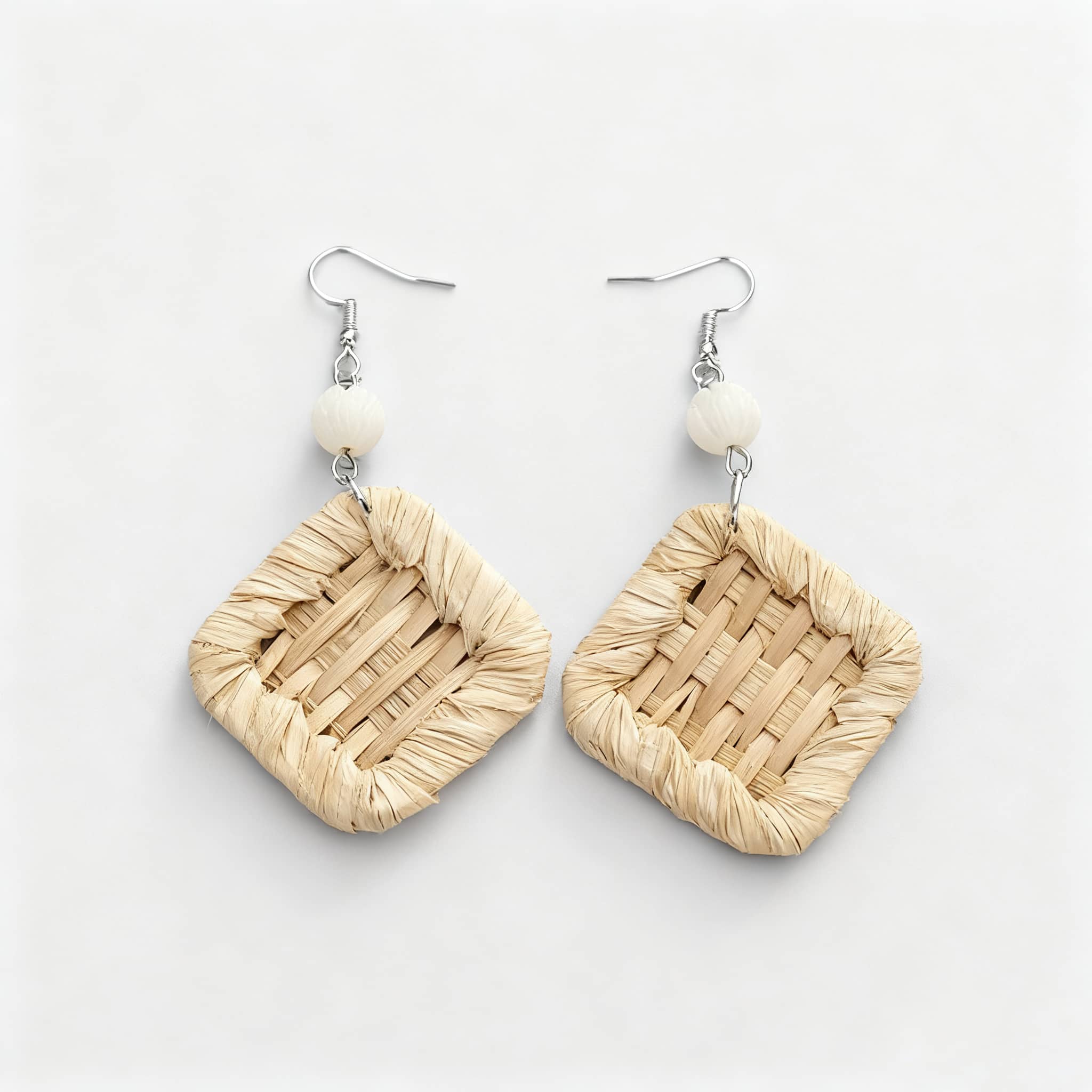 Square rattan earrings for women featuring a woven design and decorative bead accents