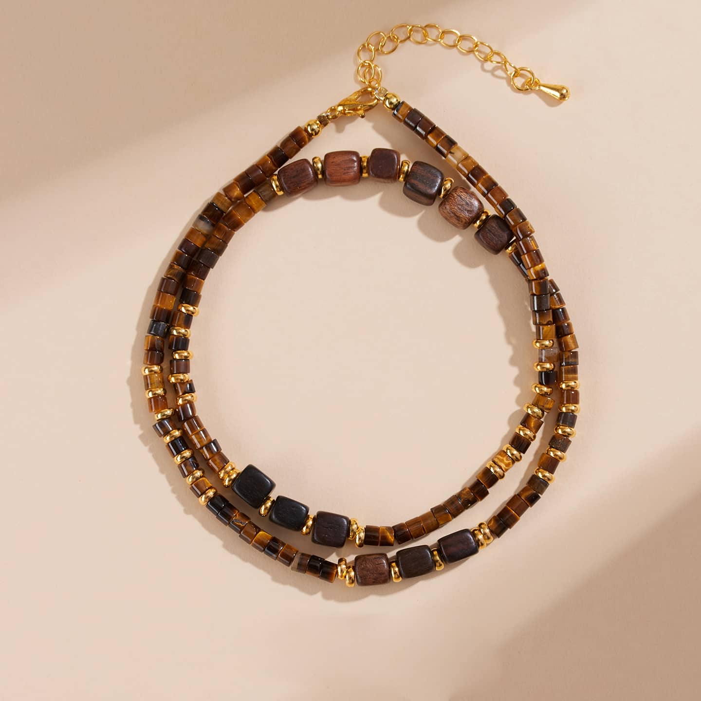 5 Senses tiger's eye anxiety necklace featuring gold accents and a layered design for calming energy