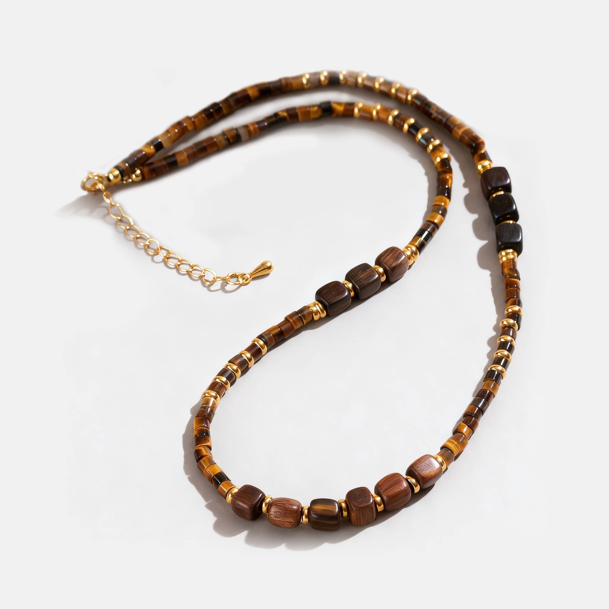 Unique earrings featuring natural beads for a stylish accessory complementing the tiger's eye anxiety necklace