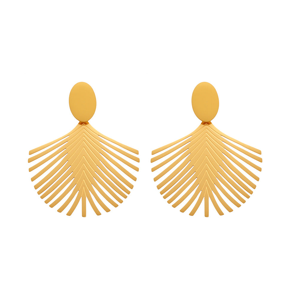 Joy gold palm leaf earrings with delicate fan-shaped design and smooth oval studs