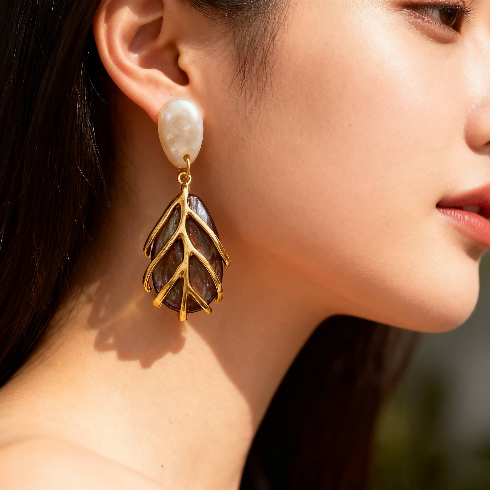 Vintage metal cage statement earrings with a unique leaf design and pearl accents