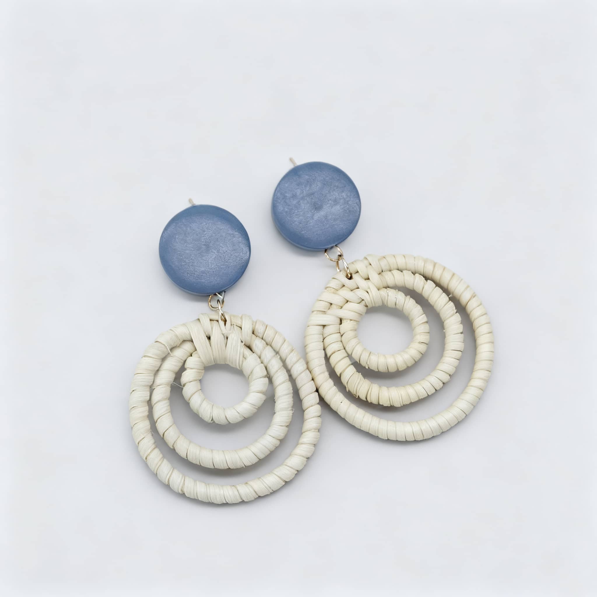 Calm woven bamboo statement earrings with blue circular tops and textured loops for a stylish look