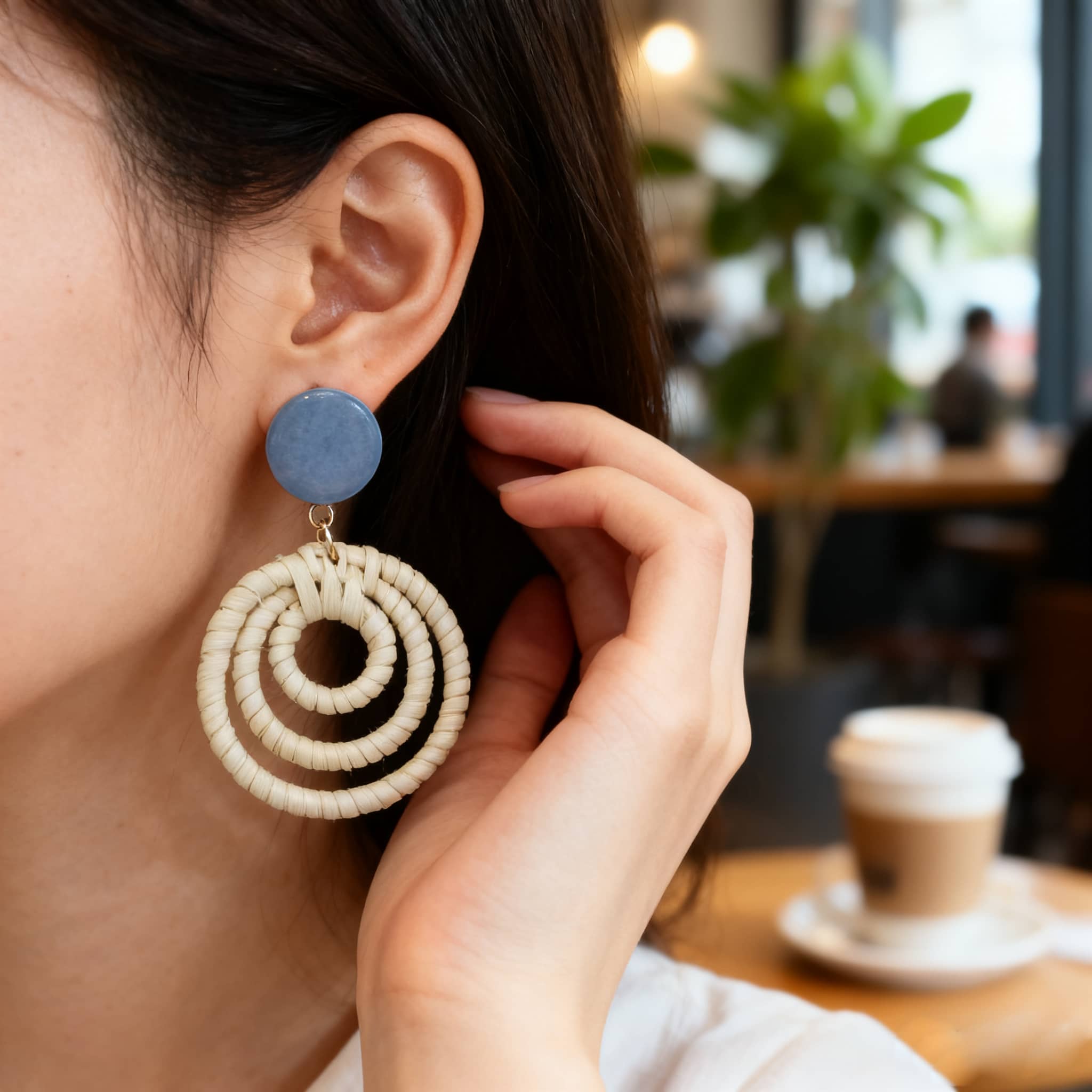 Woven bamboo statement earrings with a round blue top and spiral design for stylish outfits