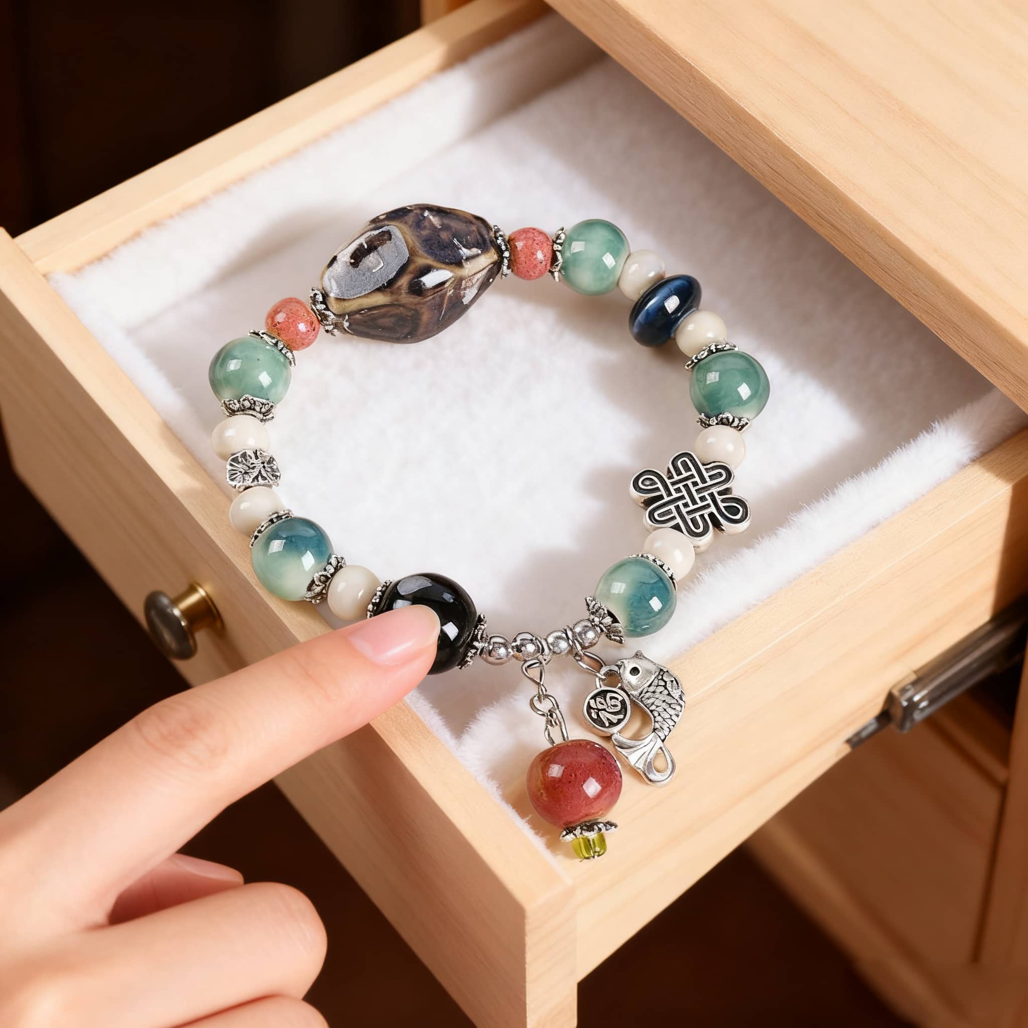 Beautiful handmade bracelet featuring ceramics and pearls, symbolizing how to be gentle with your insecurity