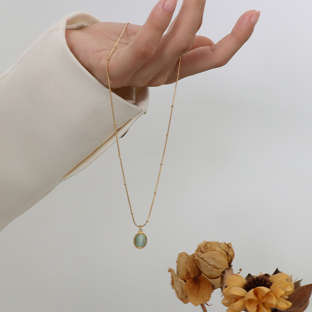 “Insecure, But Still Shining” – Green Cat’s Eye Pendant Necklace