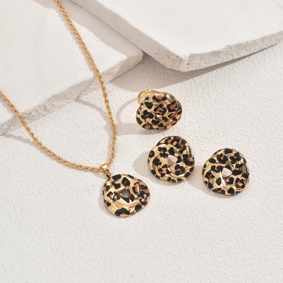 Gold necklace with matching ring and earrings featuring geometric leopard jewelry set textured hammered discs
