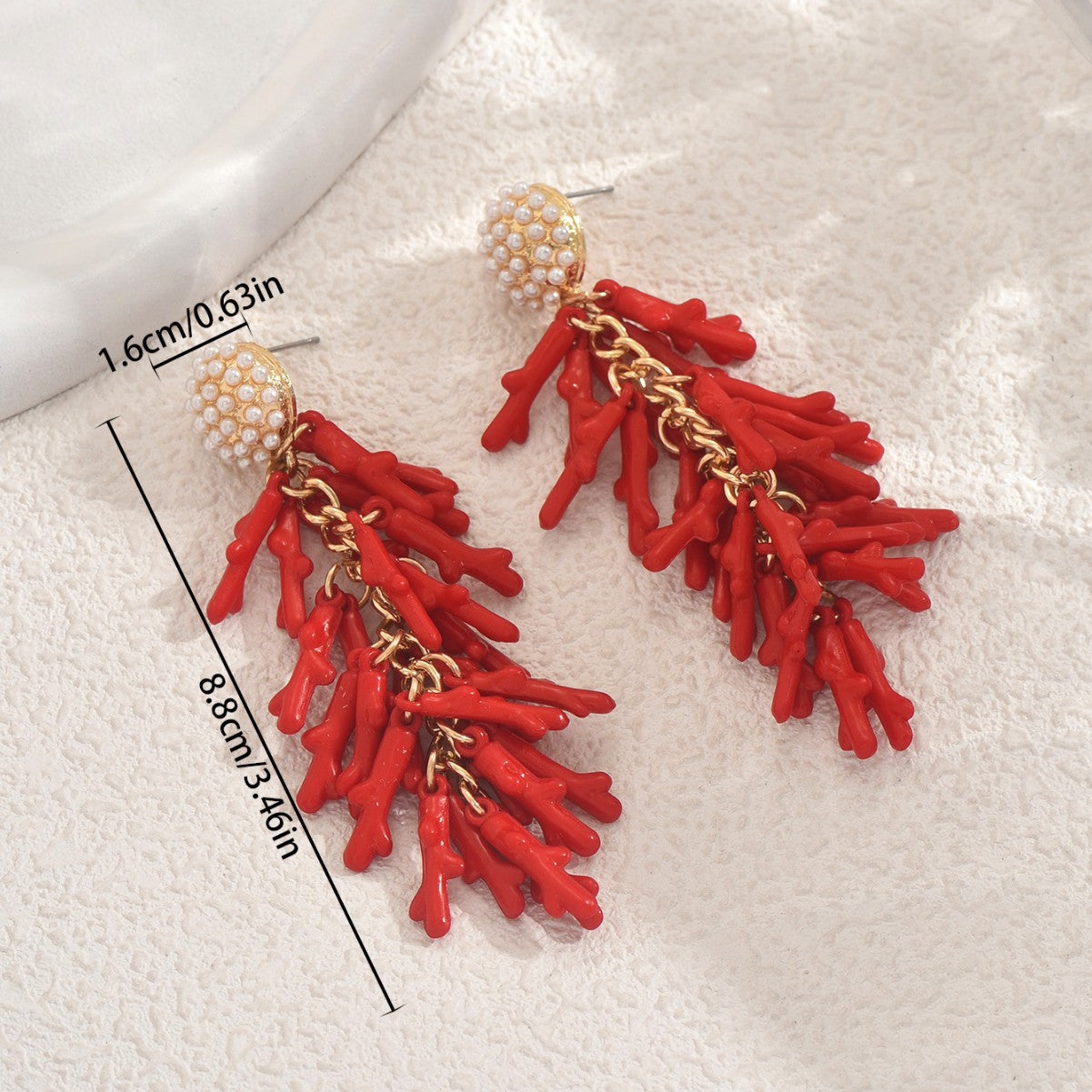 red coral tassel earrings with clustered coral branch drops on gold chains and pearl stud tops for statement wear