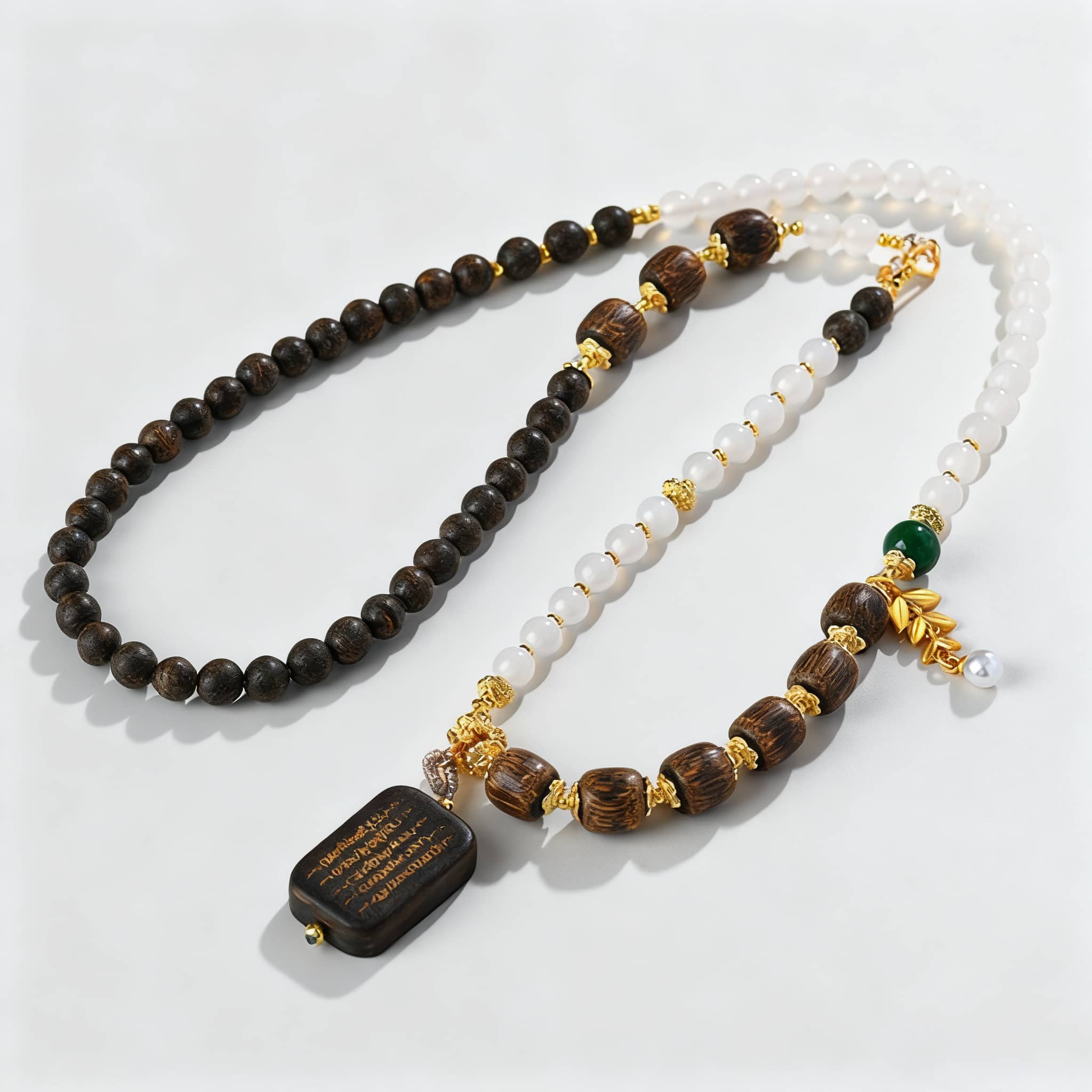 Anxious necklace featuring agarwood and white onyx jewelry with gold accents and unique design