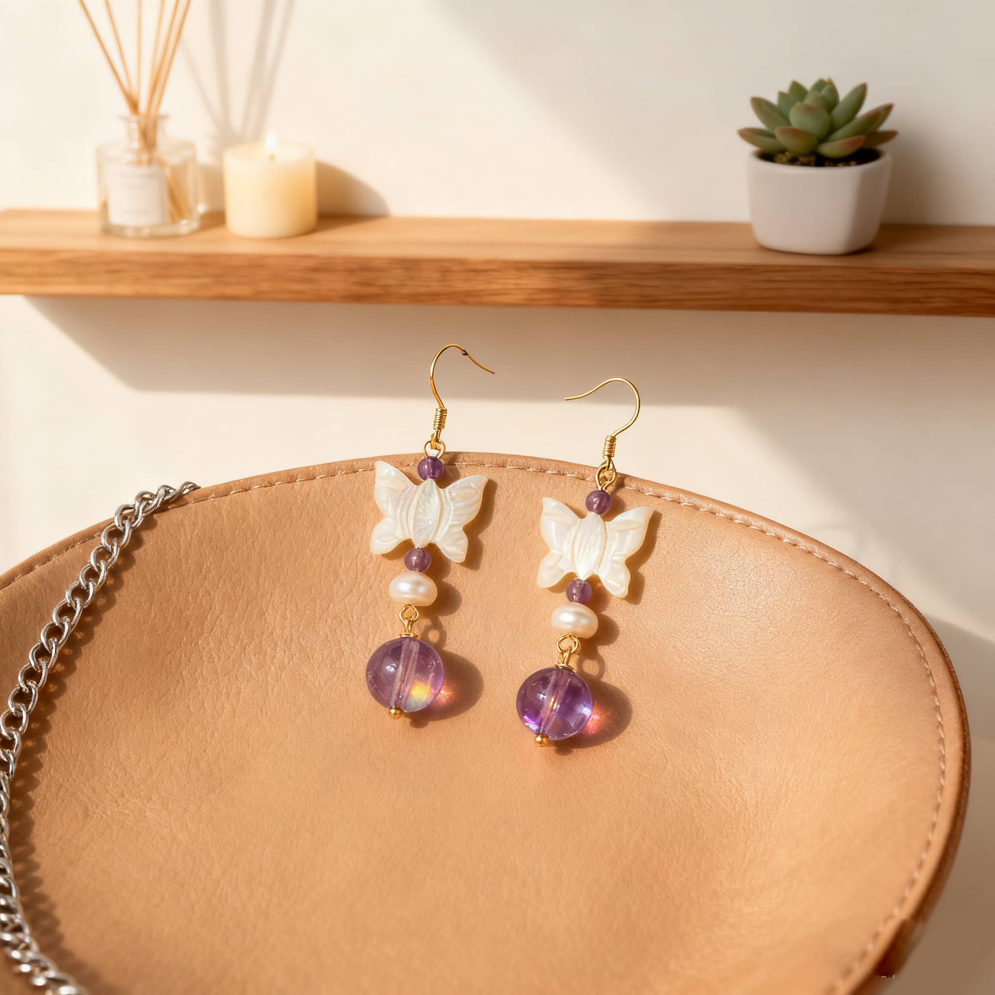 Amethyst butterfly pearl earrings featuring elegant butterfly and purple bead design