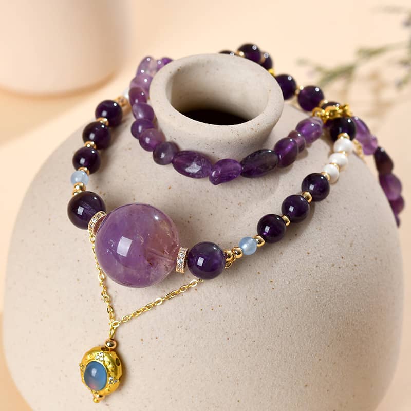 Anxious necklace featuring amethyst pearl aquamarine jewelry with gold accents and a unique design