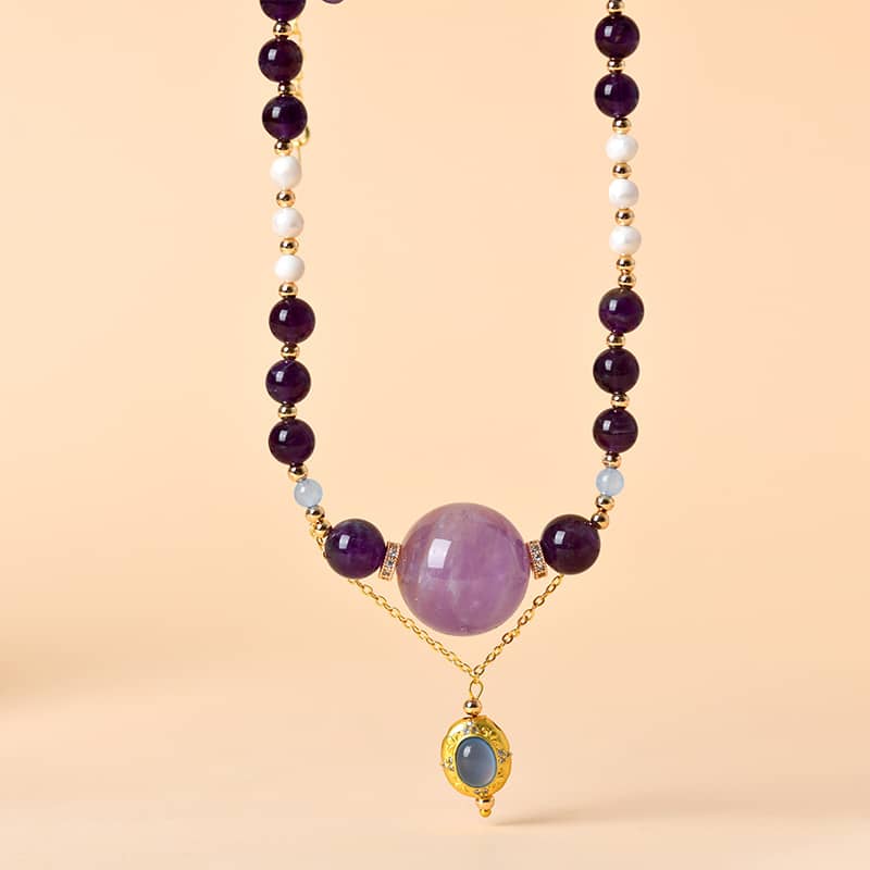Anxious necklace featuring amethyst pearl aquamarine jewelry with gold accents and colorful beads