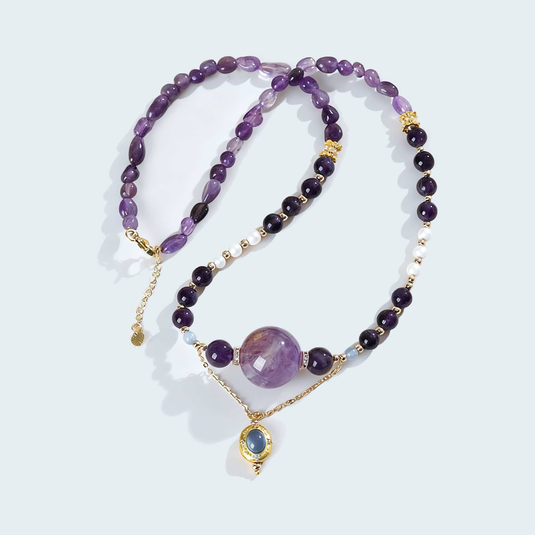 Anxious necklace featuring amethyst pearl aquamarine jewelry with gold accents and unique bead design