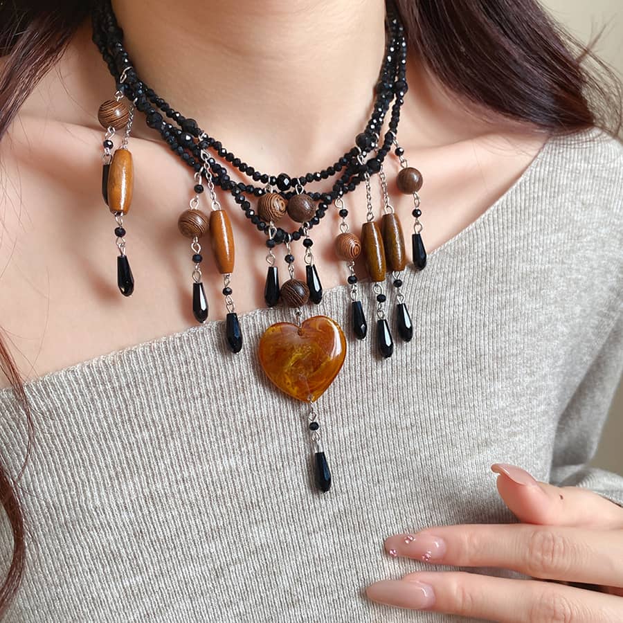 Stylish angry heart resin necklace with black beads and unique pendant for a bold look