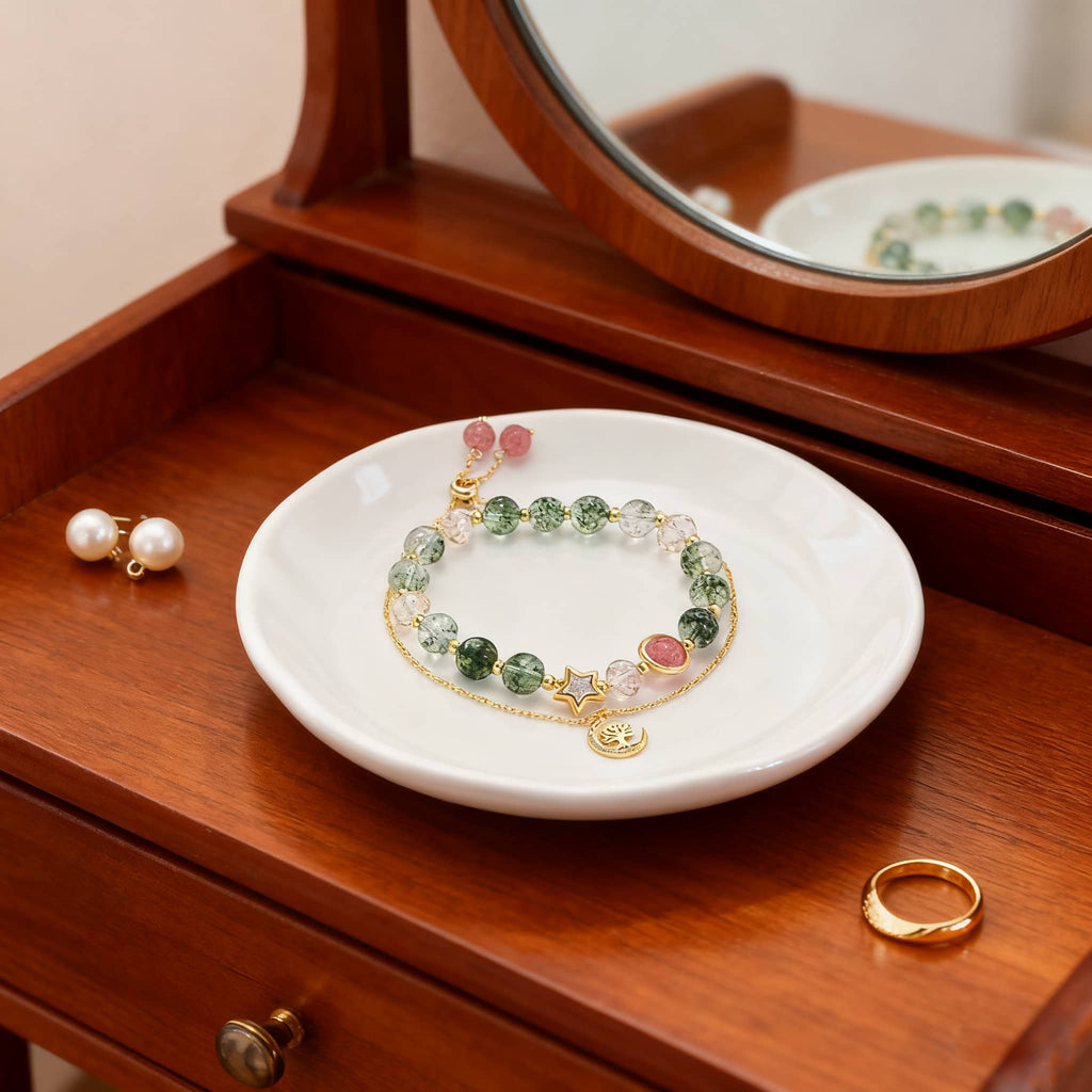 Anxiety relief crystal bracelet displayed on a white plate, featuring natural stones and gold accents