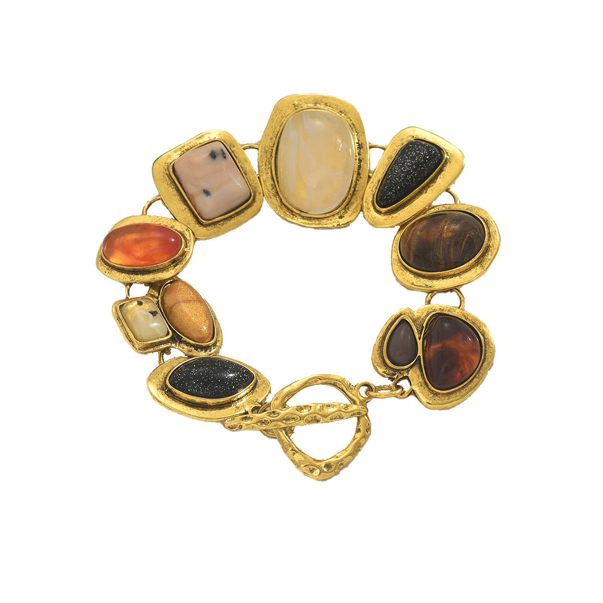 Gold toggle multicolor gemstone bracelet with irregular bezel set stones including amber black druzy and agate