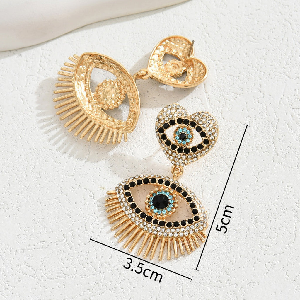 Gold tone heart angel eye stud earrings with crystal pave blue center and fringe 5 cm drop