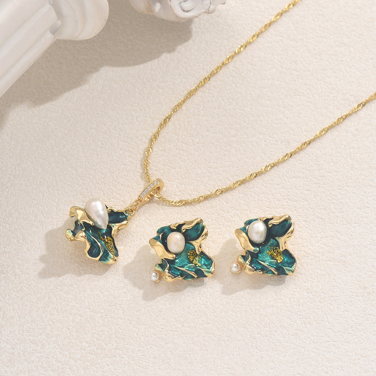 Gold and green enamel lake shaped pearl jewelry set with white freshwater pearls and twisted gold chain