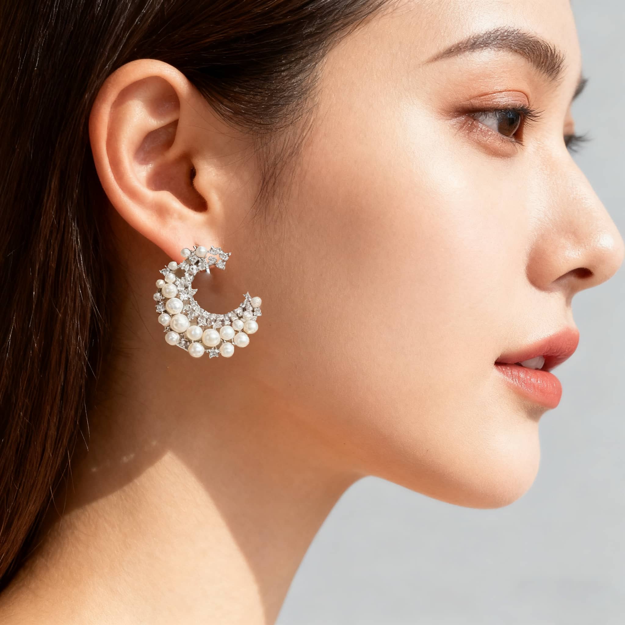 Unique baroque pearl earrings with a geometric design featuring pinecone accents