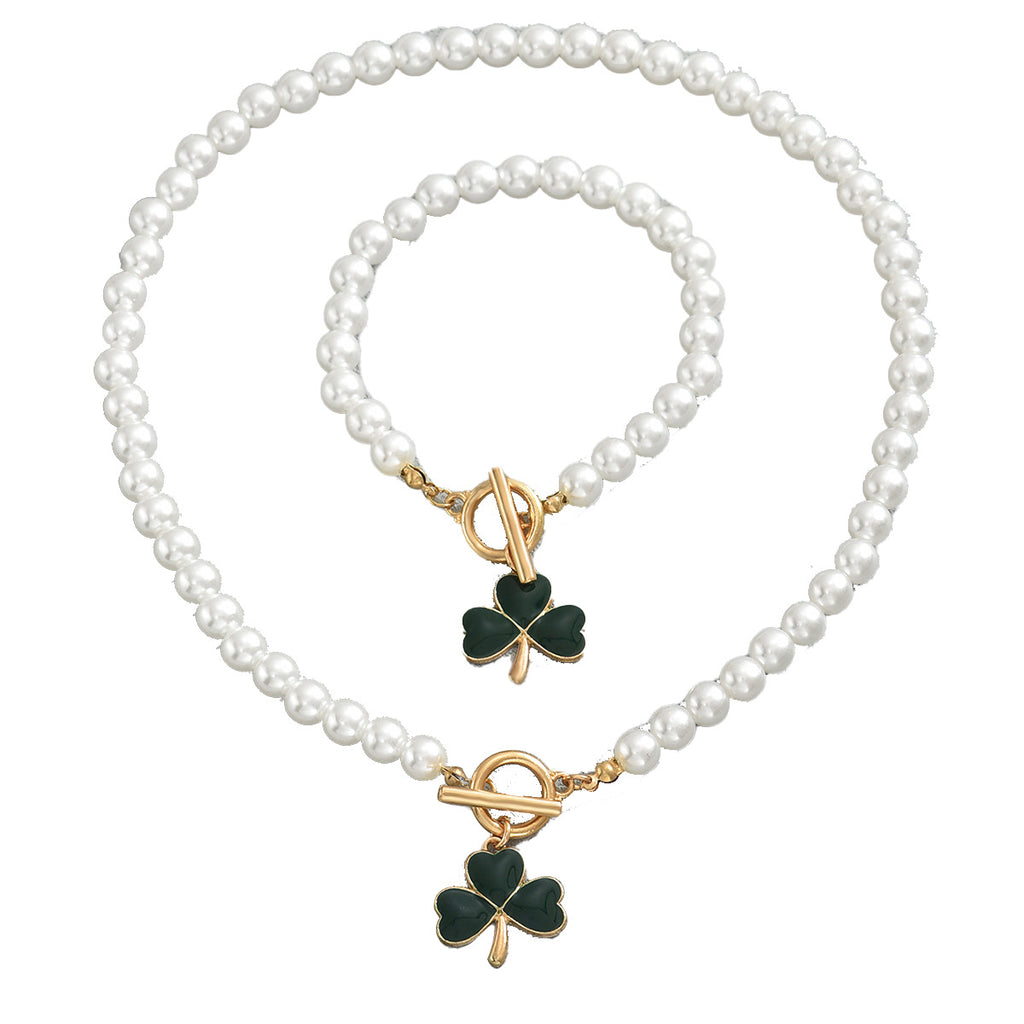heart and clover pearl jewelry set featuring gold toggle clasps and green enamel clover charms on necklace and bracelet