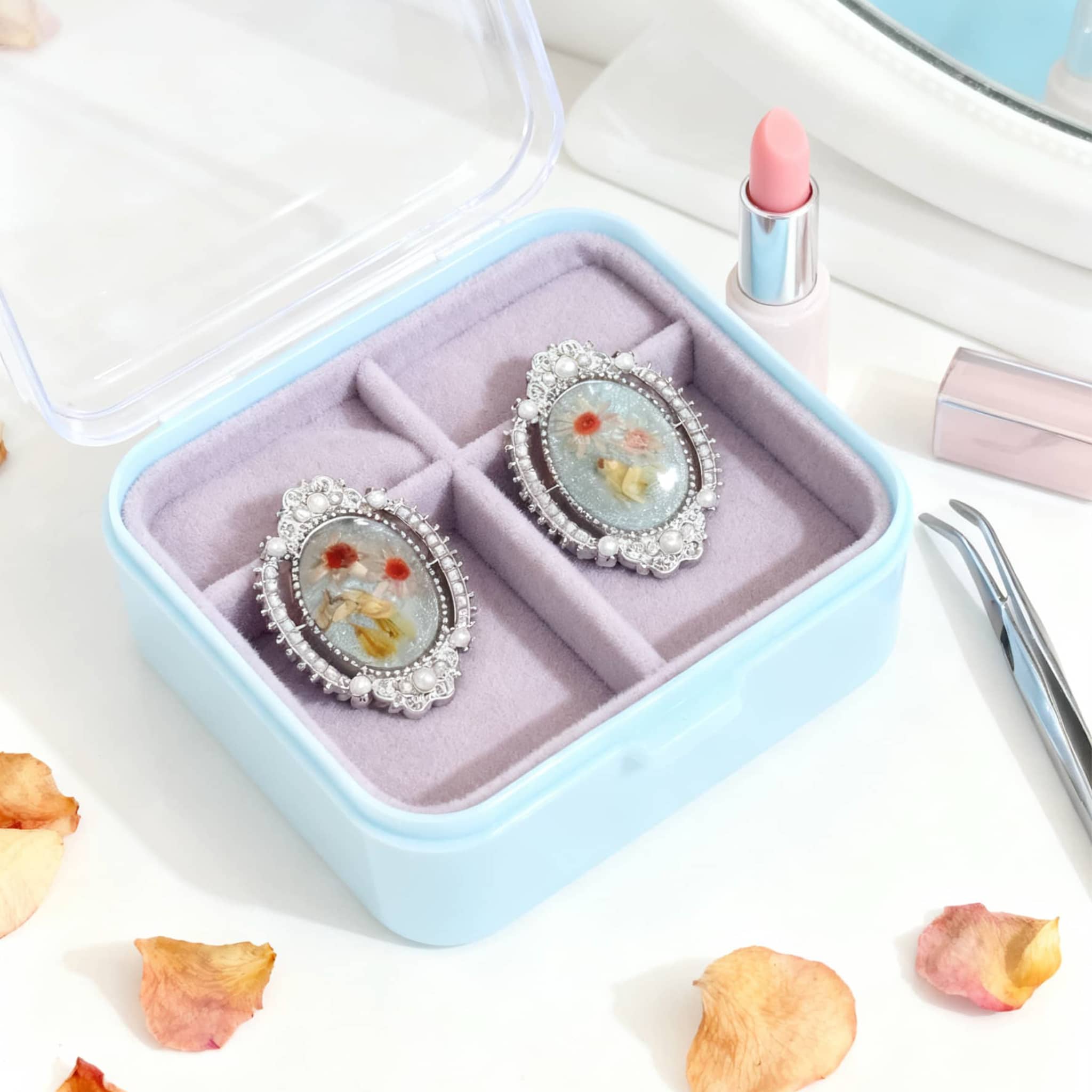 Stylish blue amber earrings for women displayed in a soft-lined jewelry box