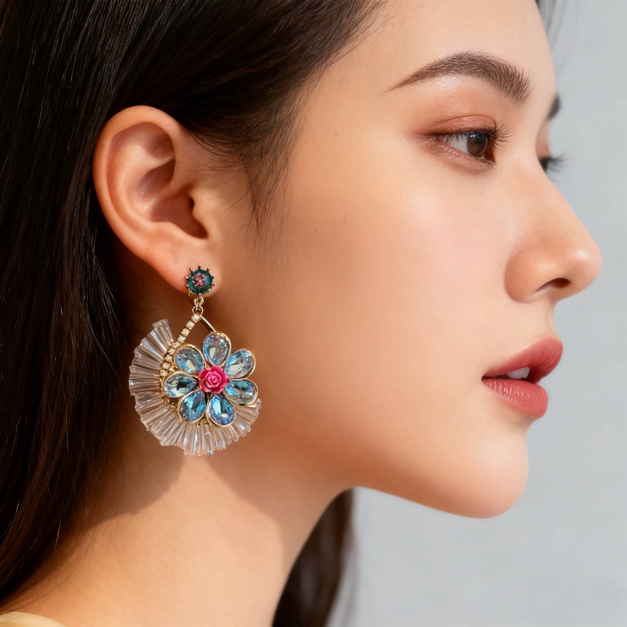 Elegant blue crystal flower earrings featuring intricate floral design and vibrant colors