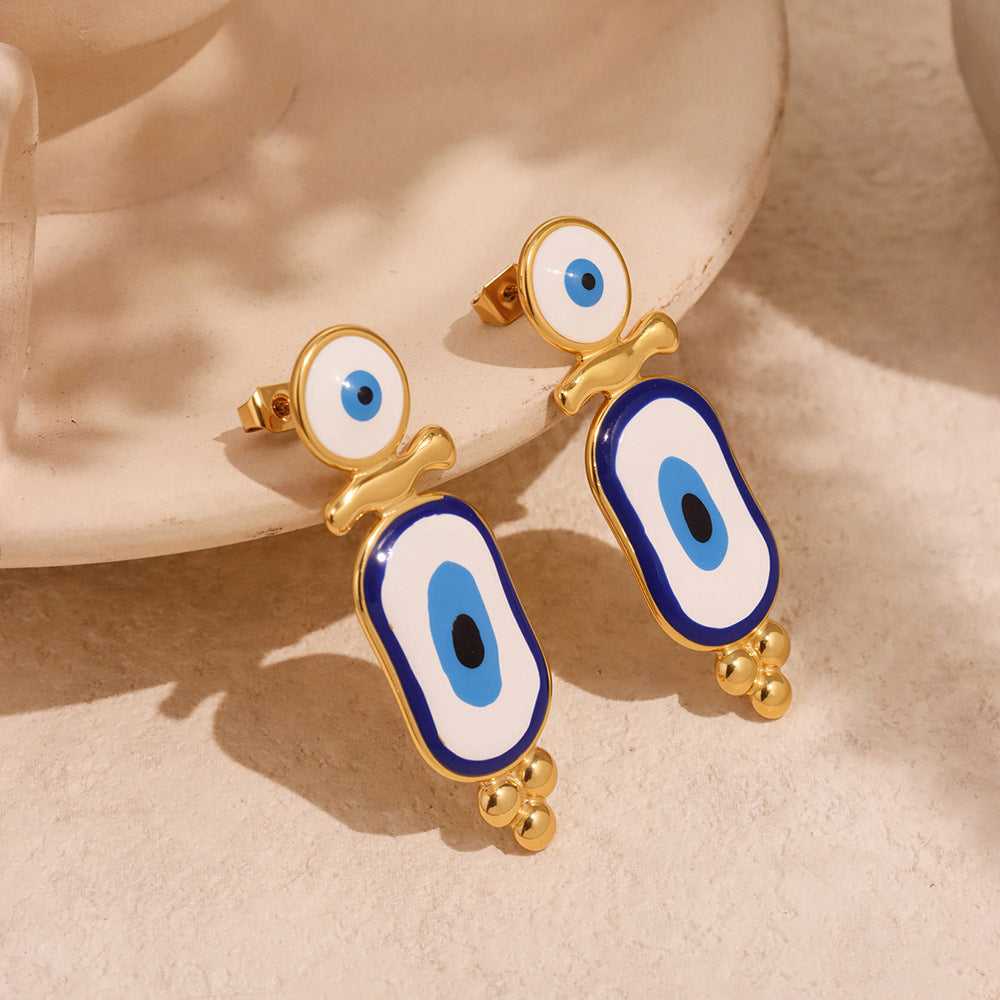 Gold Anxious blue evil eye earrings with white and blue enamel design for protection and style