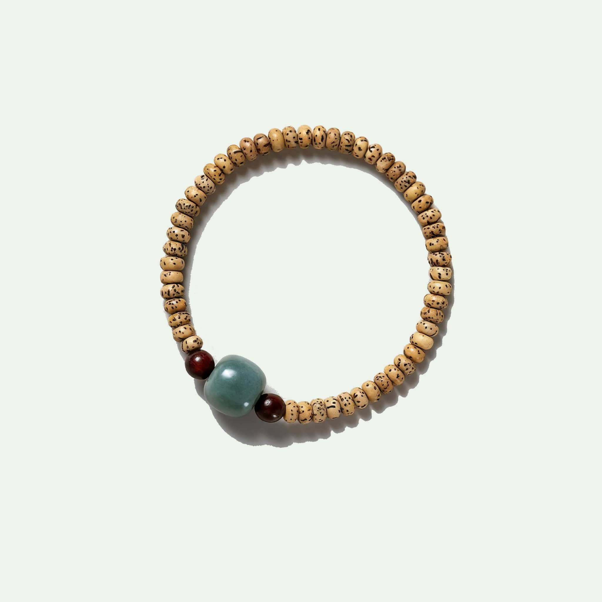 Bodhi seed meditation bracelet from 5 Senses featuring natural wooden beads and calming design