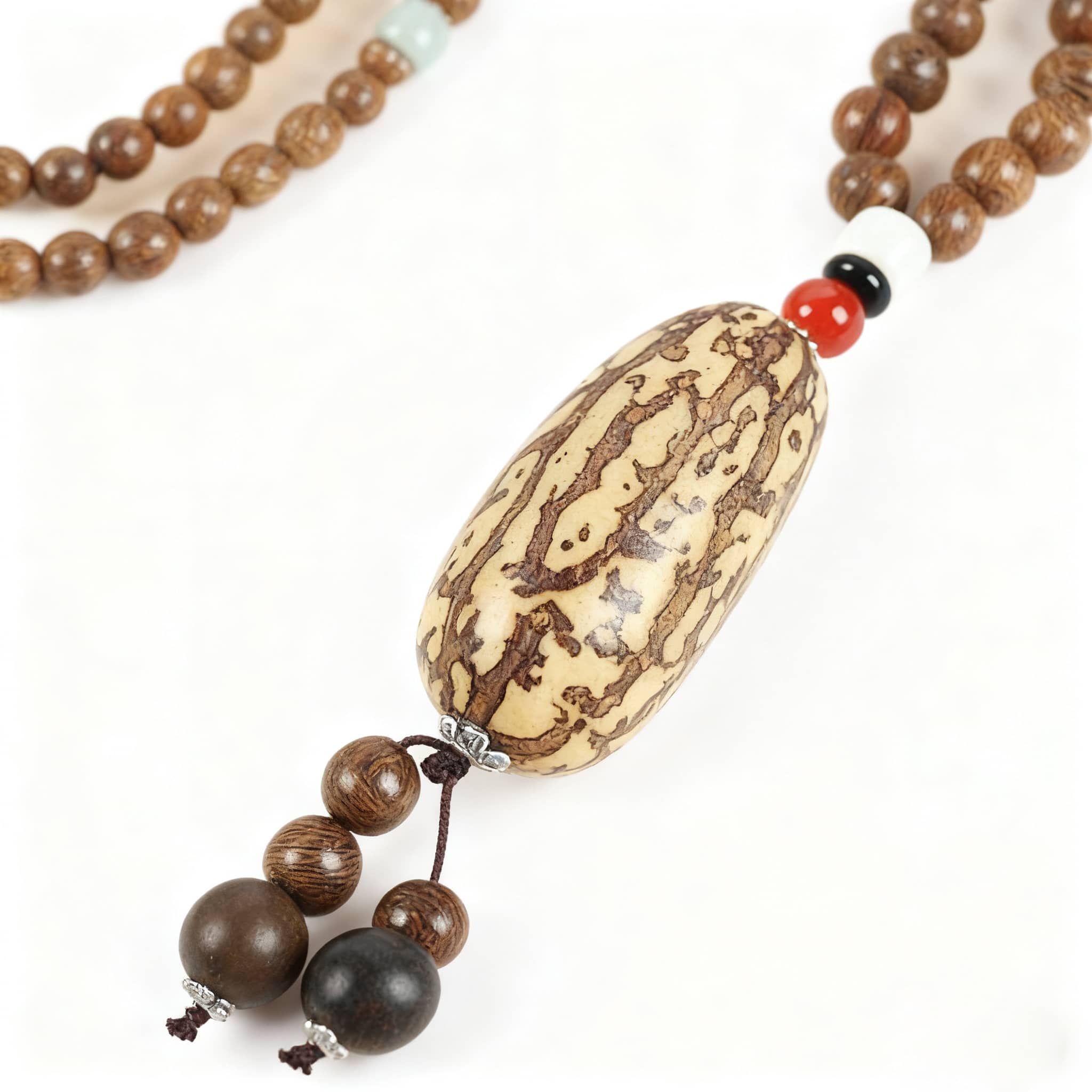 Angry bodhi seed wood bead necklace featuring unique patterned beads and decorative accents