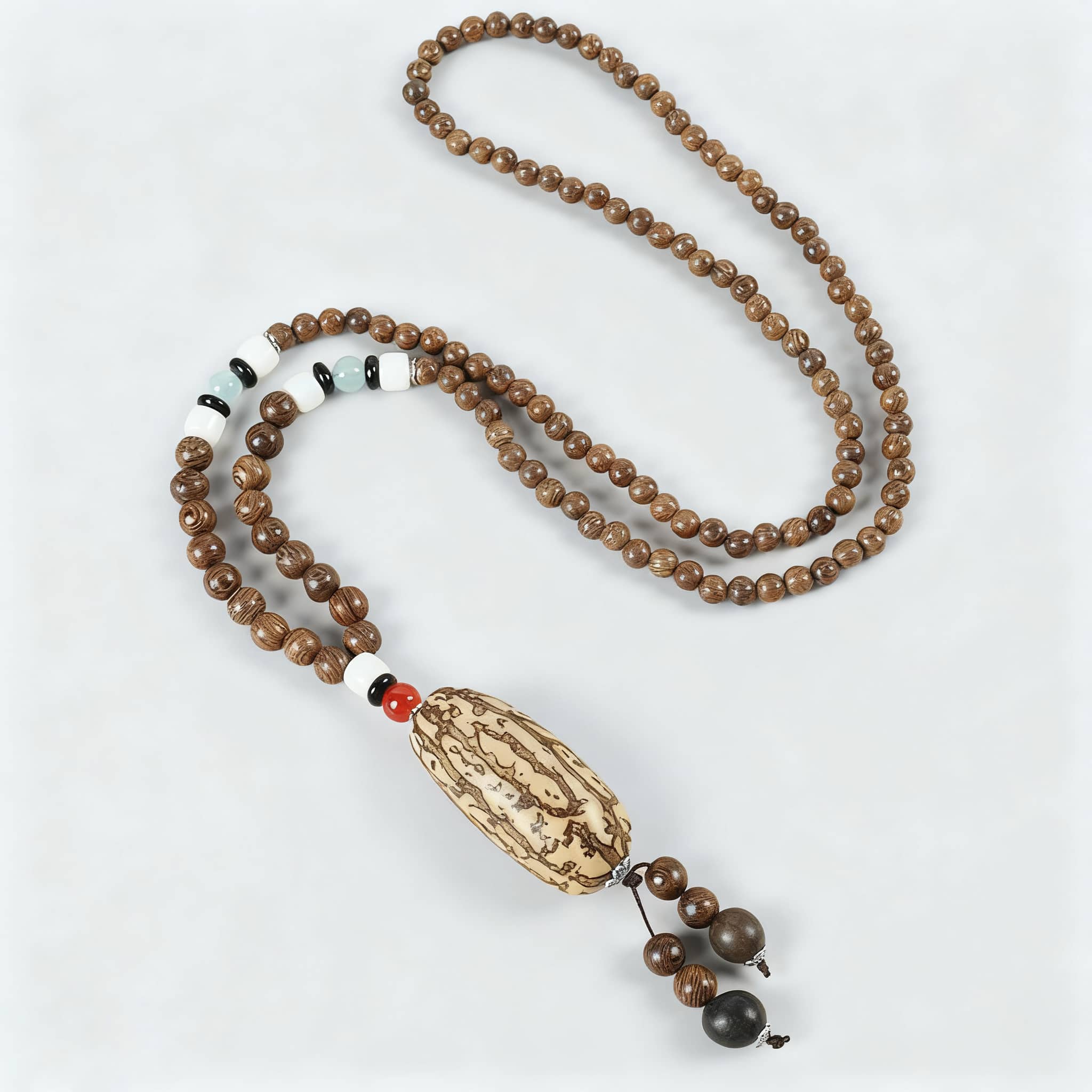 Angry bodhi seed wood bead necklace with unique pendant and decorative elements