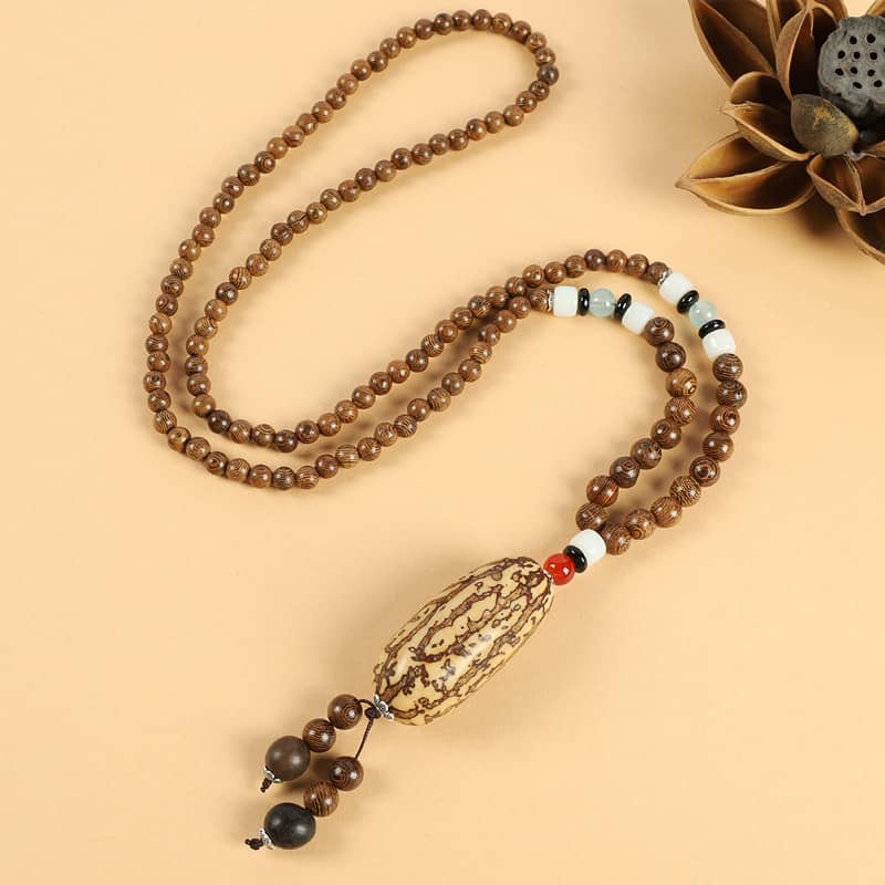 Angry bodhi seed wood bead necklace with decorative accents and unique charm for spiritual wear