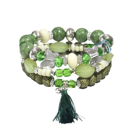 Green and cream beaded bracelet trio with silver butterfly charms and green tassel for layering