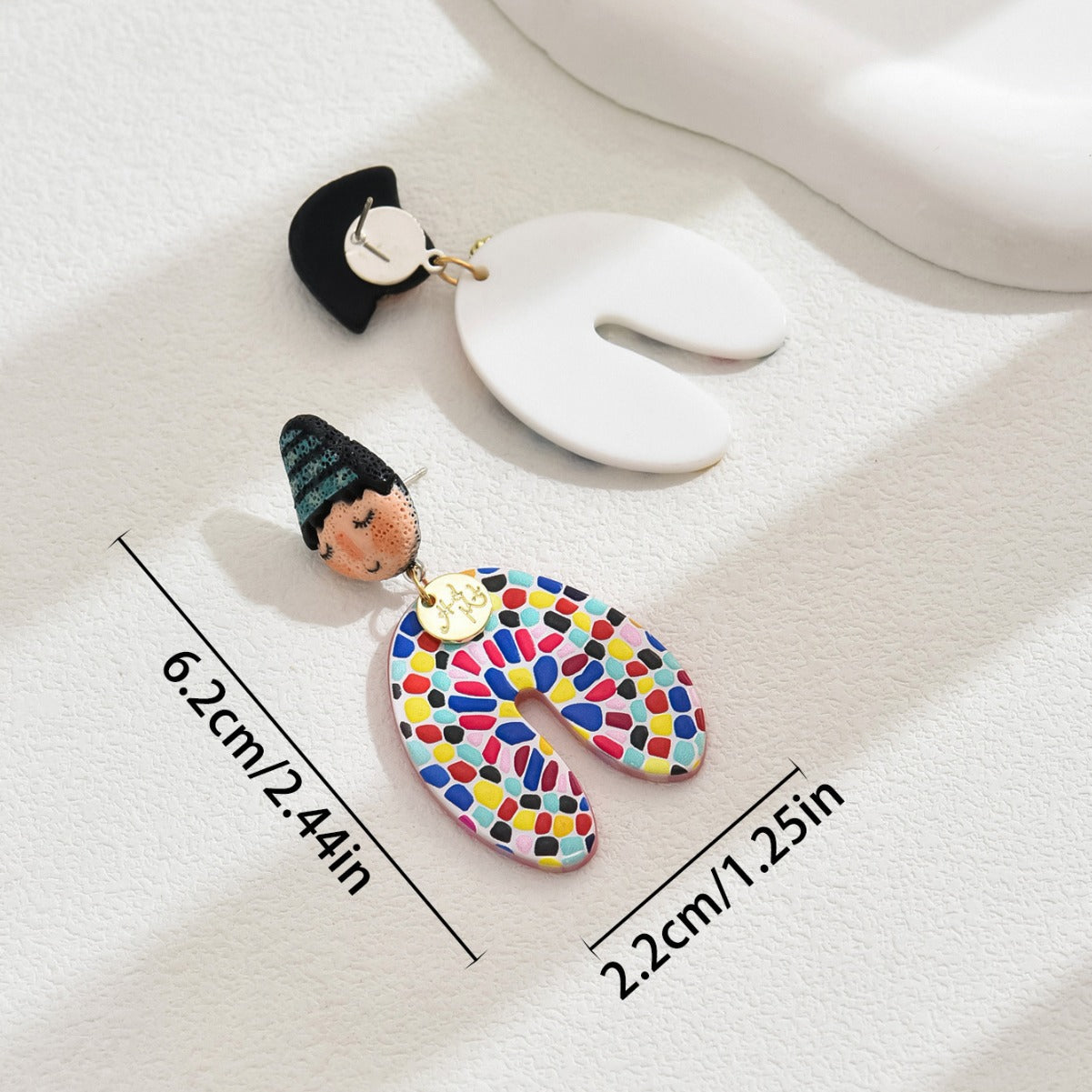 colorful Indian doll earrings featuring hand painted doll head and multicolor mosaic resin pendant with size markings