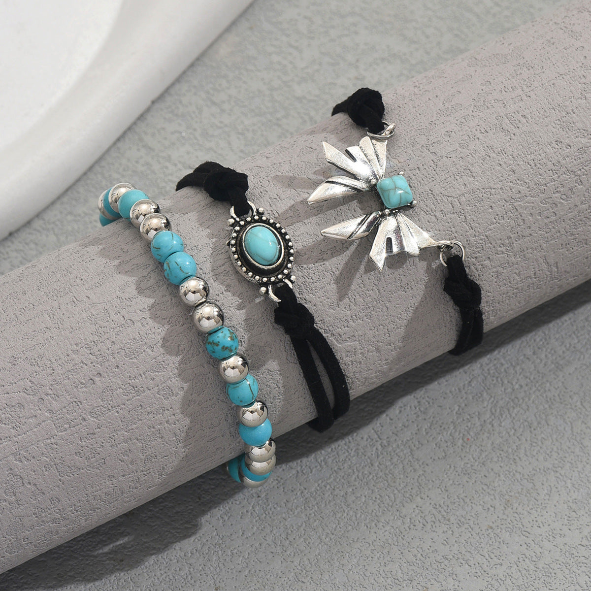 Three piece geometric butterfly bracelet set with turquoise beads silver accents and black cord