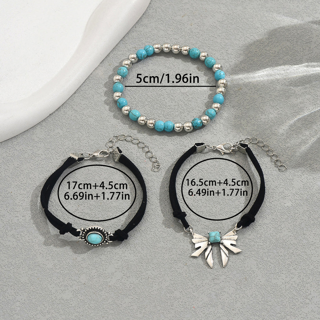 geometric butterfly bracelet set with turquoise beaded stretch bracelet and two adjustable black cord bracelets