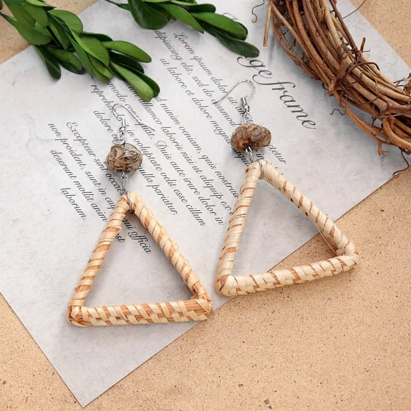 Calm woven triangle earrings crafted with natural fibers and decorative beads for a serene look