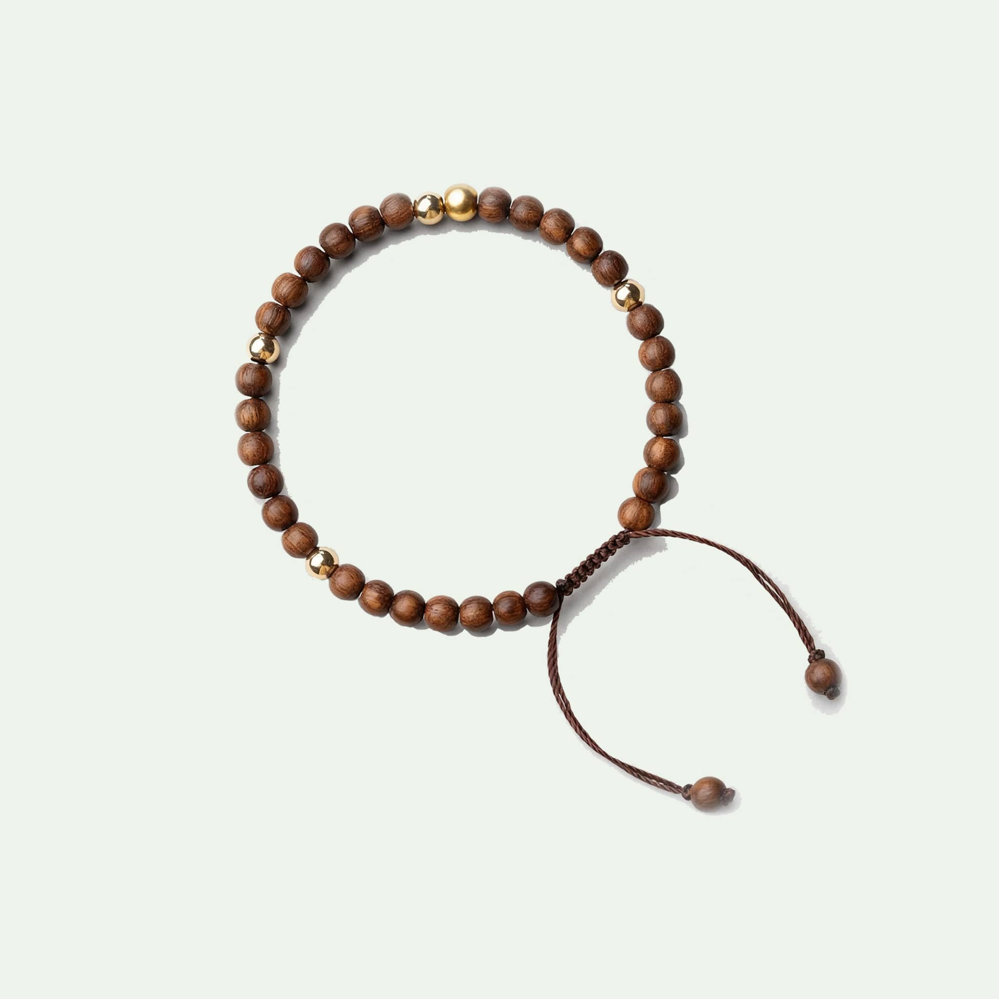 Calming silkwood gold bead bracelet designed for relaxation and style with adjustable closure
