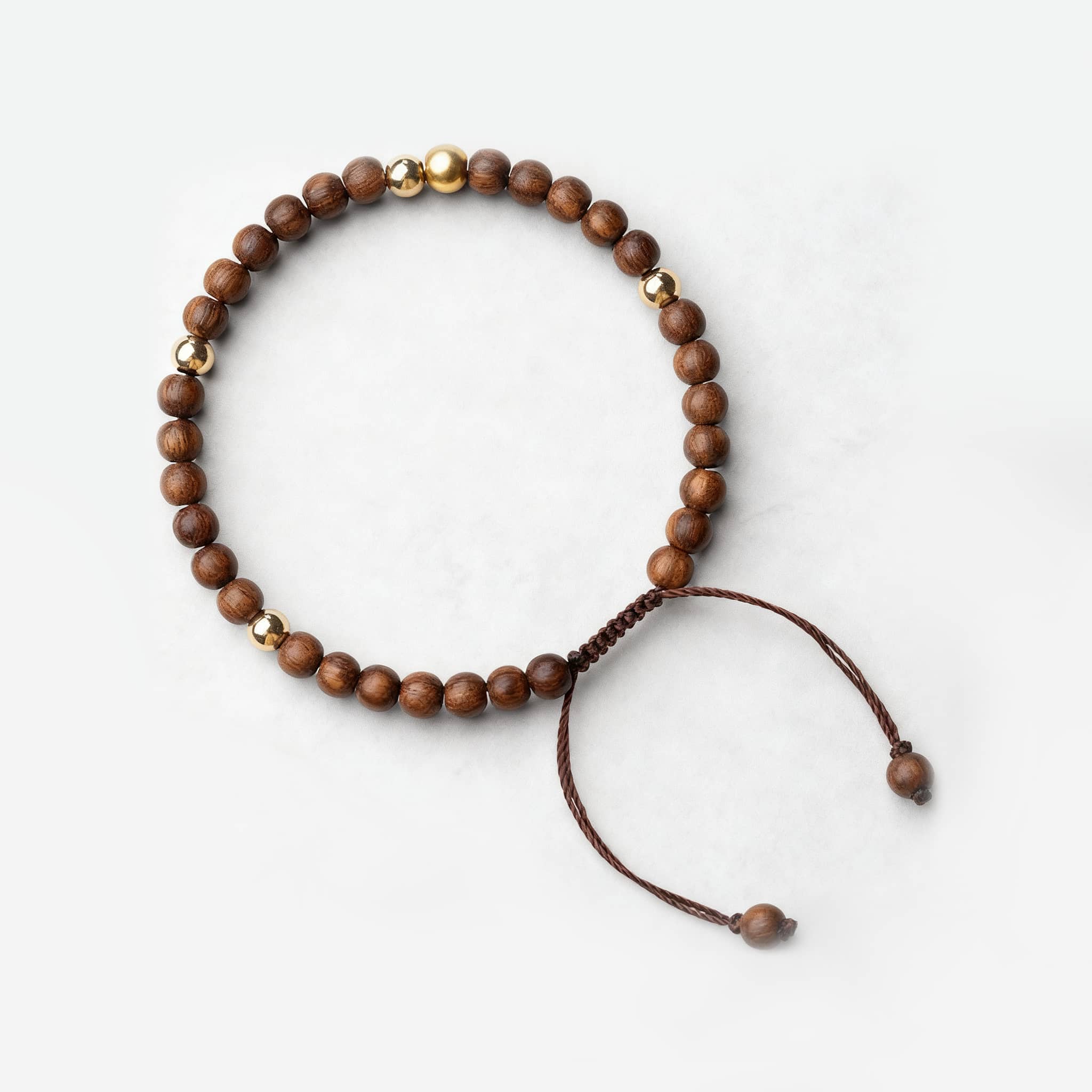 Calming silkwood gold bead bracelet with a simple design for relaxation and mindfulness